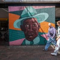 A couple enjoy a walk through Amsterdamse Poort shopping district.