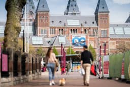 People walking outside Rijksmuseum at Museumplein
