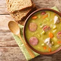 Classic Dutch pea soup erwtensoep, snert closeup in the plate on the table. horizontal top view from above
1873721881
Typically Dutch foods