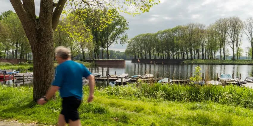 A person jogs alongside Sloterplas.