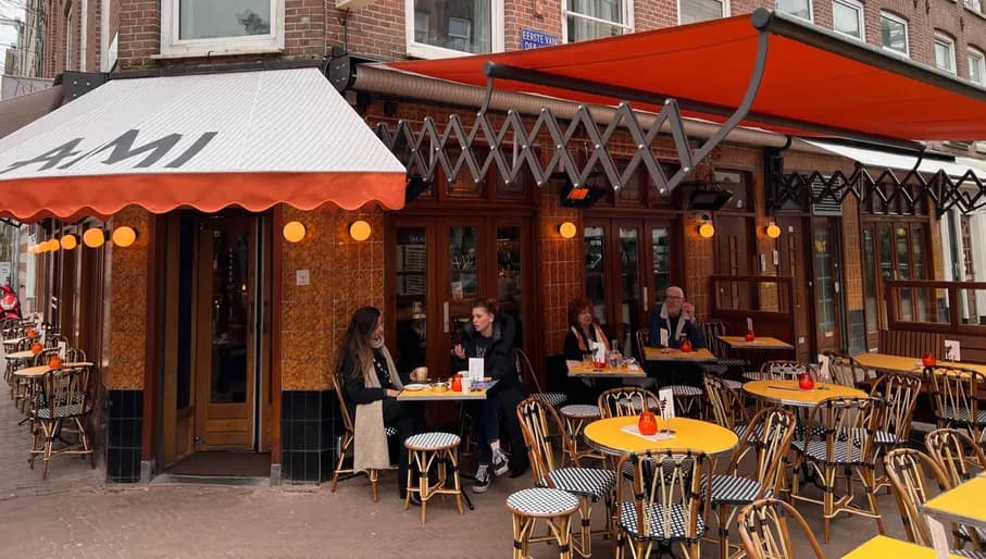 People sitting at the terrace of AMI Amsterdam