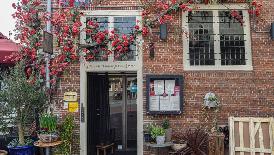 Frenchie Restaurant doorway with flowers
