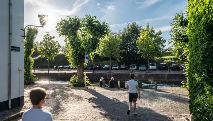 People walking towards the canal in Naarden.
