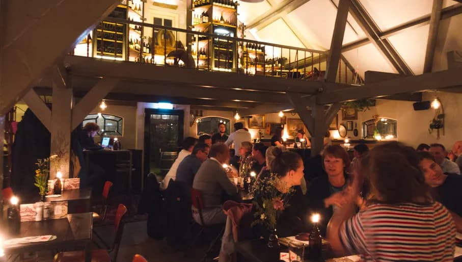 People having a drink inside Vergulden Eenhoorn