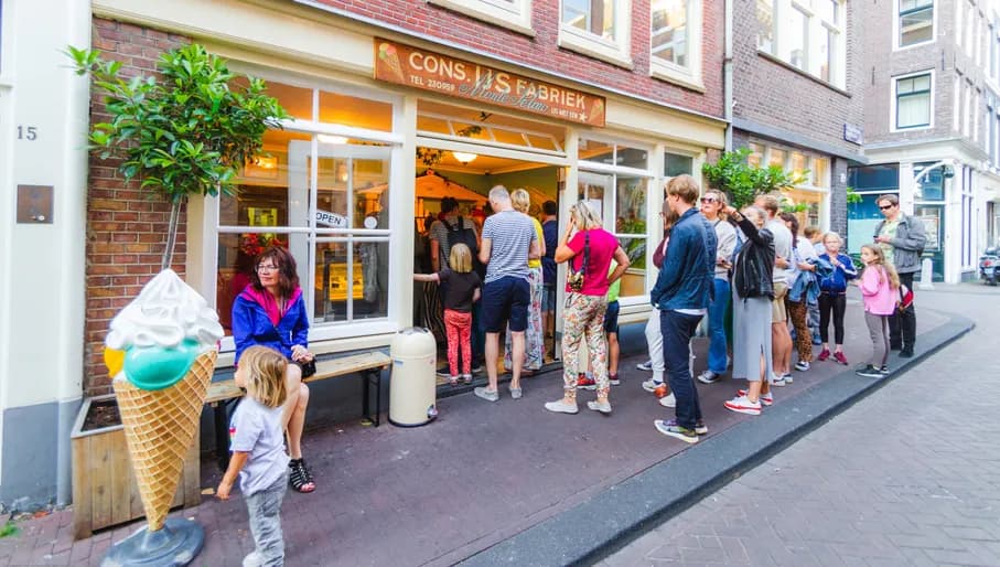 People standing in a line outside Monte Pelmo ice cream shop