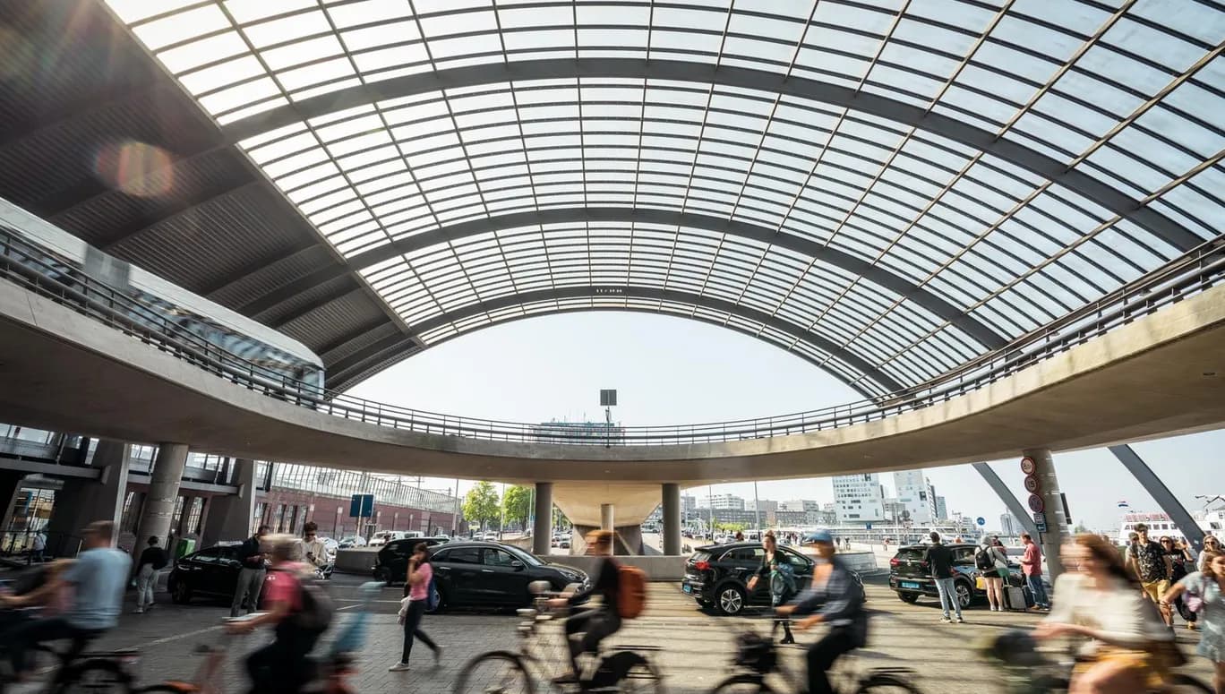 Cyclist at Amsterdam Centraal Station.