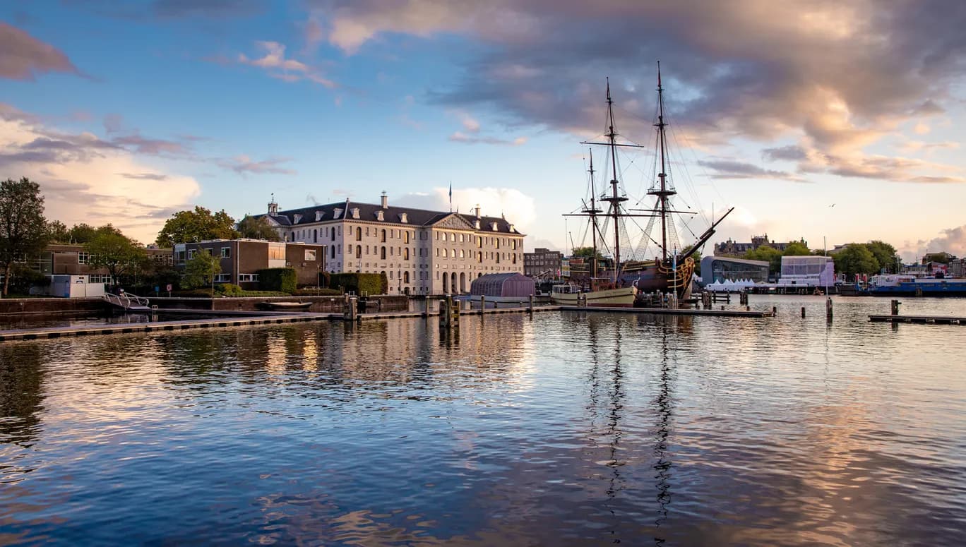A canal view of Het Scheepvaartmuseum National Maritime Museum and VOC ship