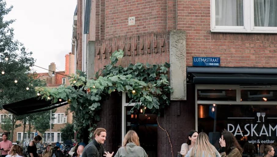 People sitting on terrace outside Paskamer wine bar in De Pijp