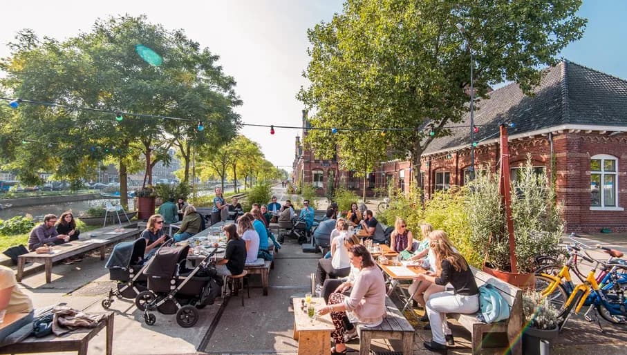 People on the terrace of De Bakkerswinkel café in Westerpark
