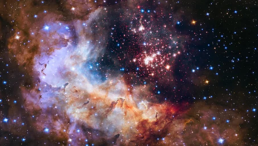 This image shows the central region of star cluster Westerlund 2 taken by the NASA/ESA Hubble Space Telescope. The image’s central region, containing the star cluster, blends visible-light data taken by the Advanced Camera for Surveys and near-infrared exposures taken by the Wide Field Camera 3. The surrounding region is composed of visible-light observations taken by the Advanced Camera for Surveys. This image of the cluster and its surroundings has been released to celebrate Hubble’s 25th year in orbit and a quarter of a century of new discoveries, stunning images and outstanding science.