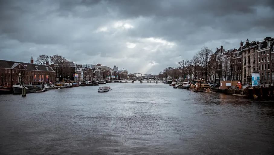 Canal with a view of the Blauwbrug Rembrandt