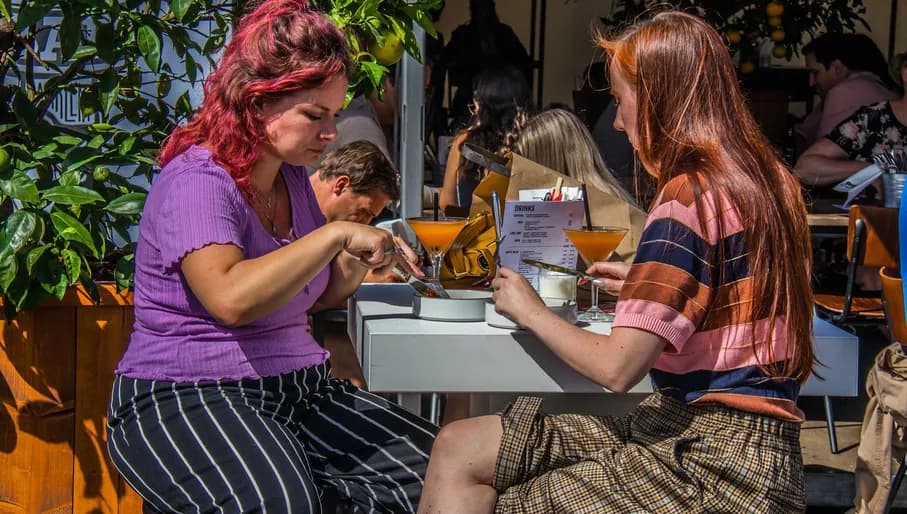 Visitors enjoying food and drinks at Haarlem Culinair food festival at the Grote Markt
