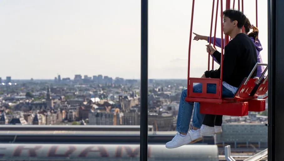 People on the / ADAM Lookout / swings