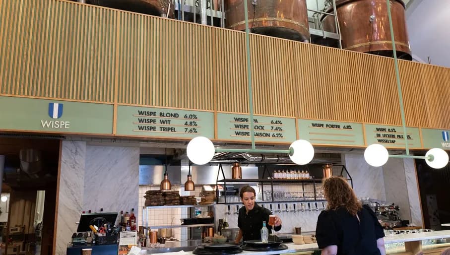A person is ordering drinks at the Wispe beer brewery in Weesp