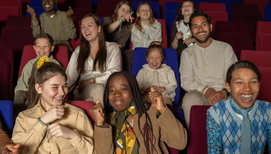 The audience enjoying the play at Theater De Krakeling.