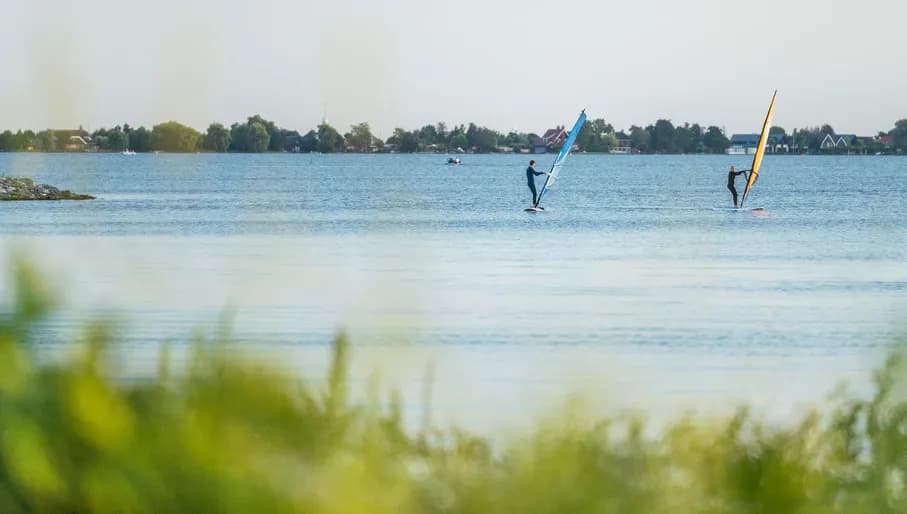 Two windsurfers on the Westeinderplassen near Aalsmeer.