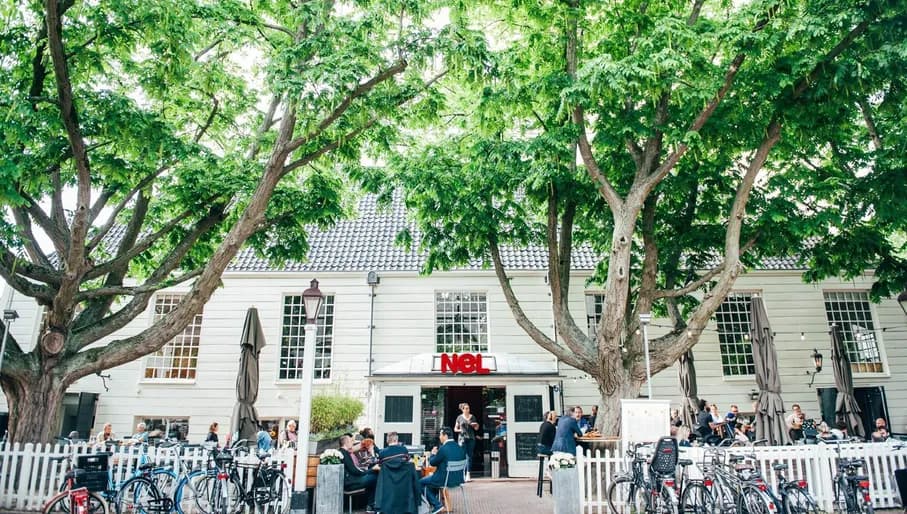 People on the terrace of Brasserie Nel at Amstelveld.